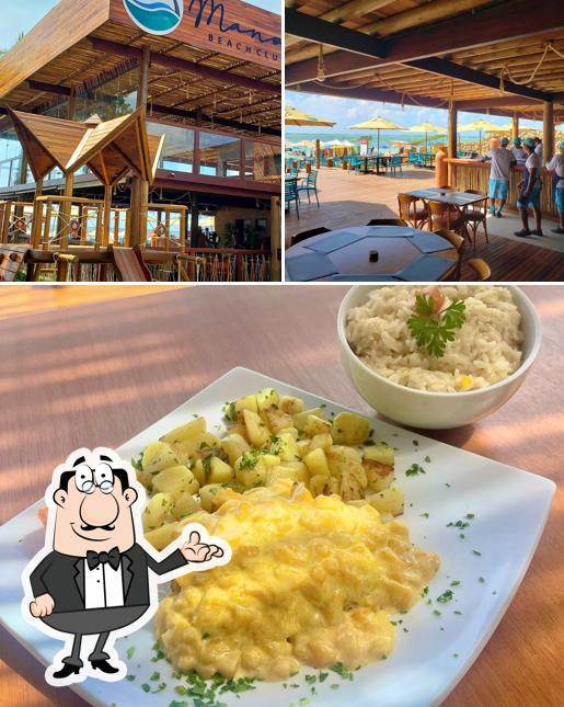 Esta é a foto mostrando interior e comida no Restaurante Manoa Beach Club