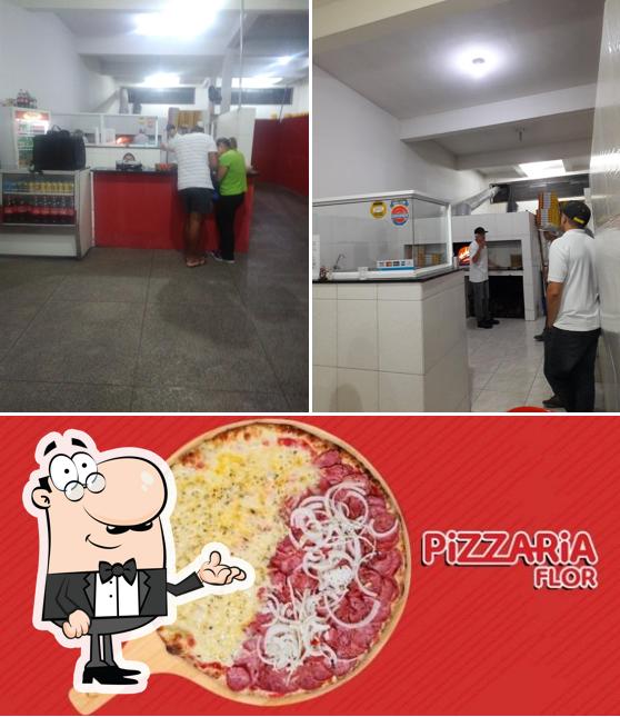 Esta é a foto mostrando interior e comida no Pizzaria Flôr