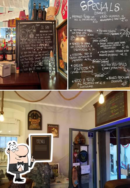 This is the image showing blackboard and interior at Piccola Osteria Bianchin