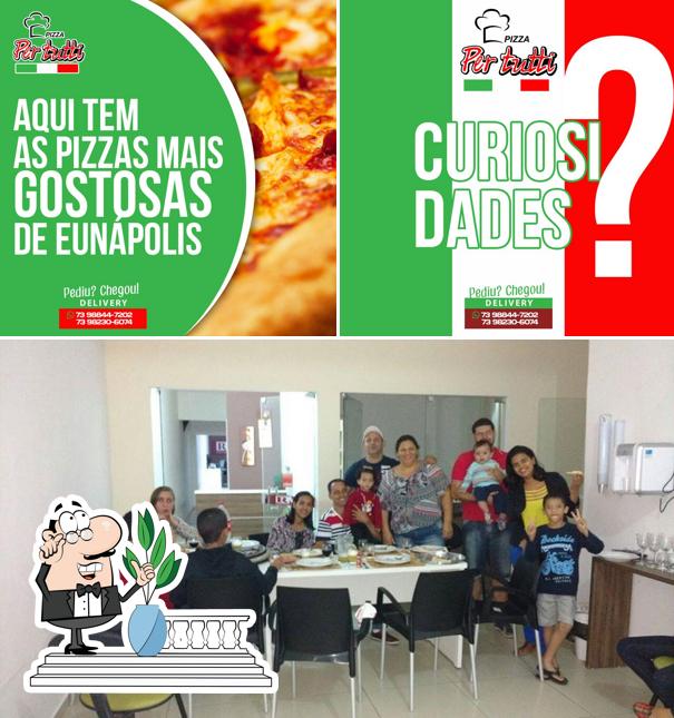 Esta é a imagem mostrando exterior e interior no Pizzaria Per Tutti