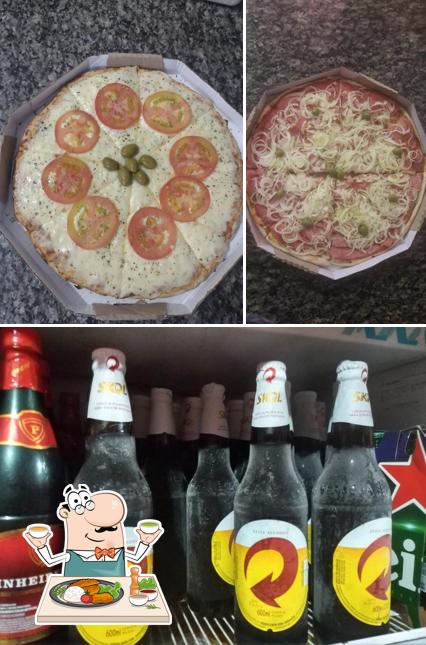 Entre diversos coisas, comida e cerveja podem ser encontrados no Pizzaria Pau no Gato