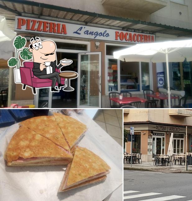 Tra le varie cose da Pizzeria L'angolo si possono trovare la interni e cibo