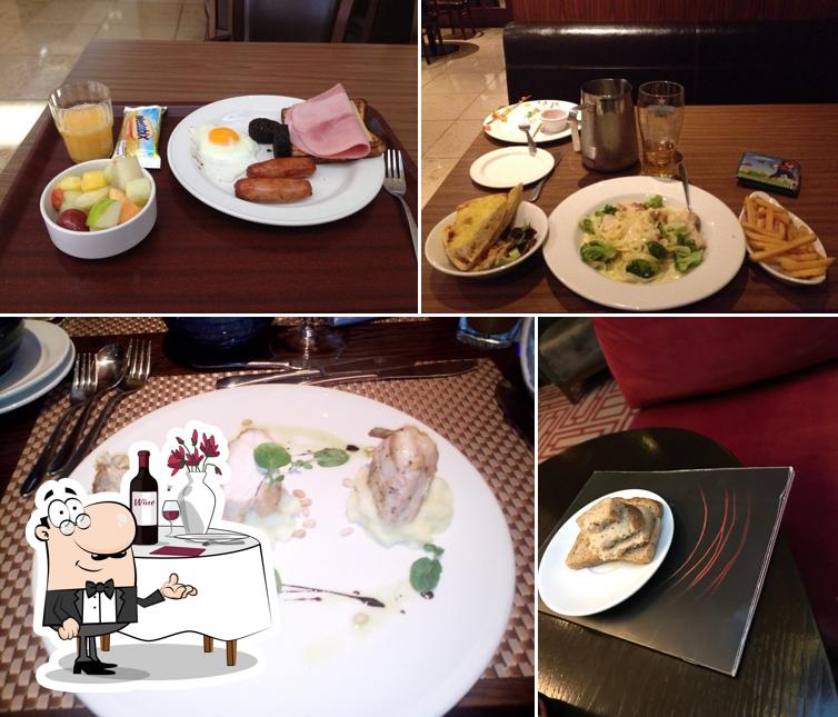 Take a look at the picture depicting dining table and food at The Brasserie