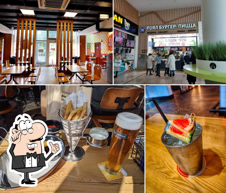 Check out the photo depicting interior and drink at Royal Burger