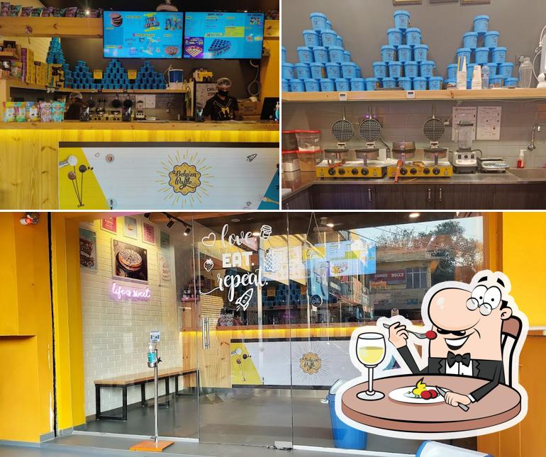 Check out the picture depicting food and interior at The Belgian Waffle Co