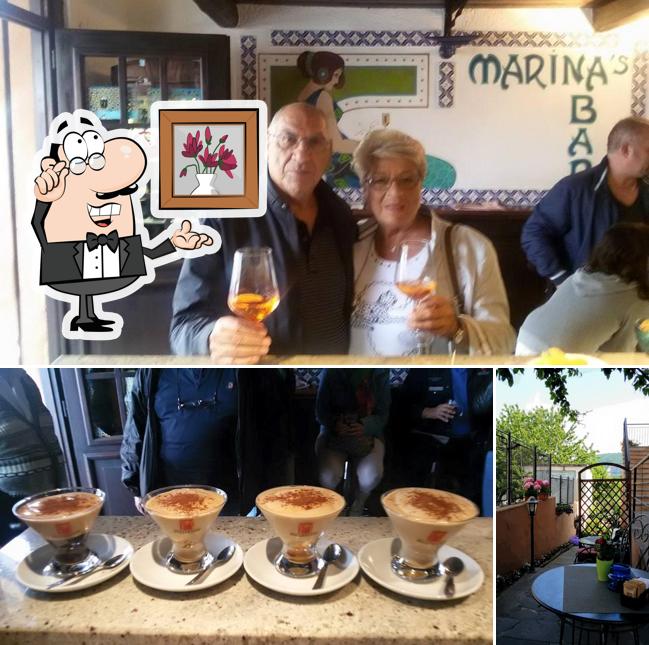 La immagine della interni e tavolo da pranzo di Bar Marina