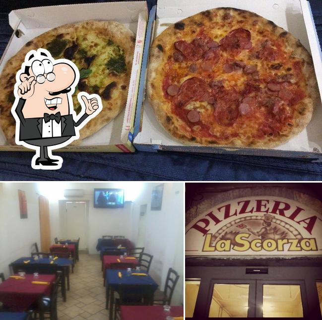 Questa è la foto che mostra la interni e pizza di Pizzeria La Scorza La Spezia