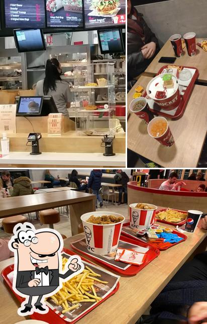 Voici l’image affichant la intérieur et table à manger sur KFC Neuville en Ferrain