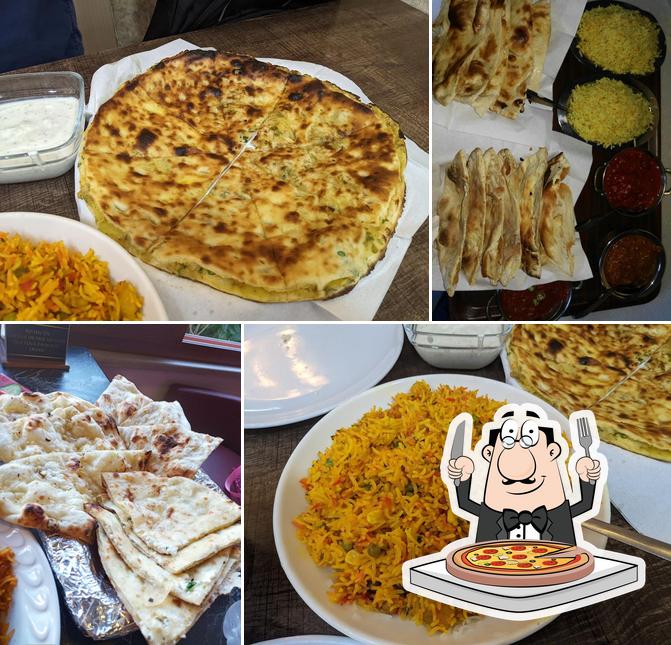 Отведайте пиццу в "DELHI DARBAR Indian Restaurant"