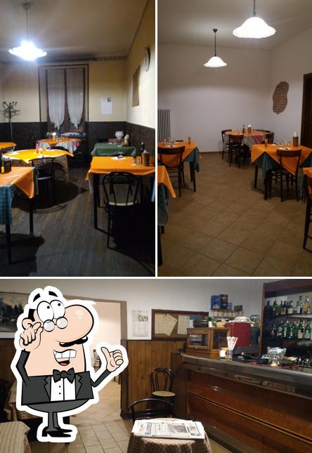 La foto di interni e tavolo da pranzo da Bar Pizzeria Trattoria Belvedere