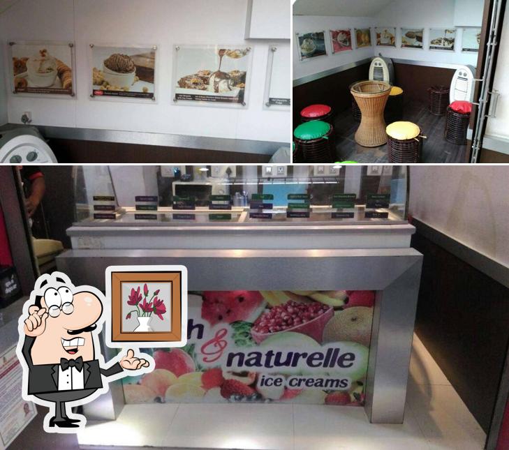 Take a seat at one of the tables at Pabrai's Fresh & Naturelle Ice Cream, HSR Layout, Bangalore