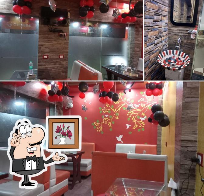 Take a seat at one of the tables at Kathi Junction काठी जंक्शन जलपानगृहस्य