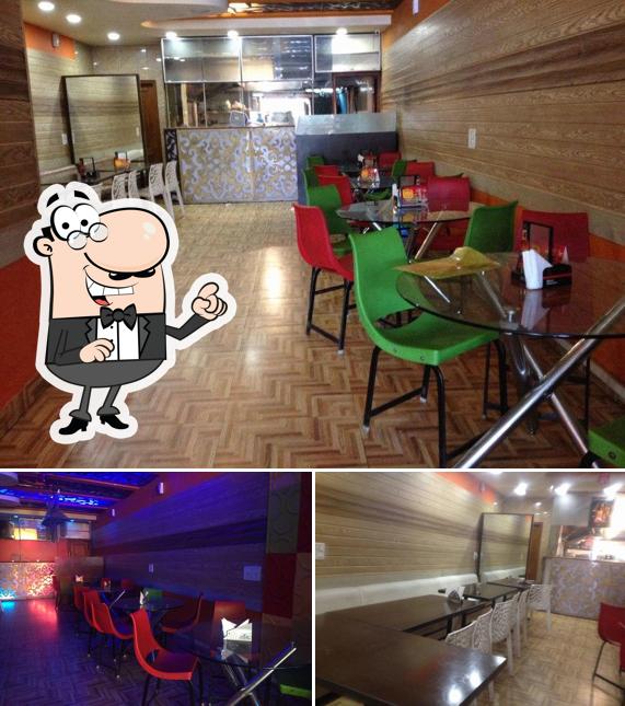 Take a seat at one of the tables at Chhatwals Fish Corner Bar And Restaurant