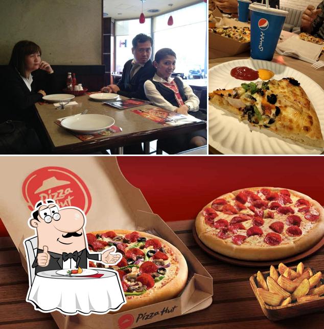 The restaurant's dining table and pizza