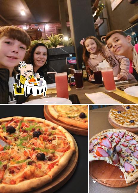 Entre diversos coisas, comida e balcão de bar podem ser encontrados a Dalú Pizzaria