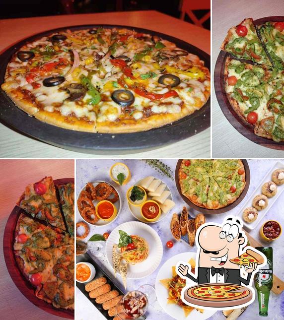 Try out pizza at The Bigg Small Cafe + Bar