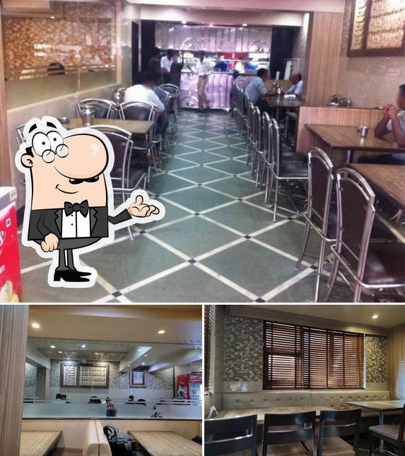 Take a seat at one of the tables at Café Bhonsle