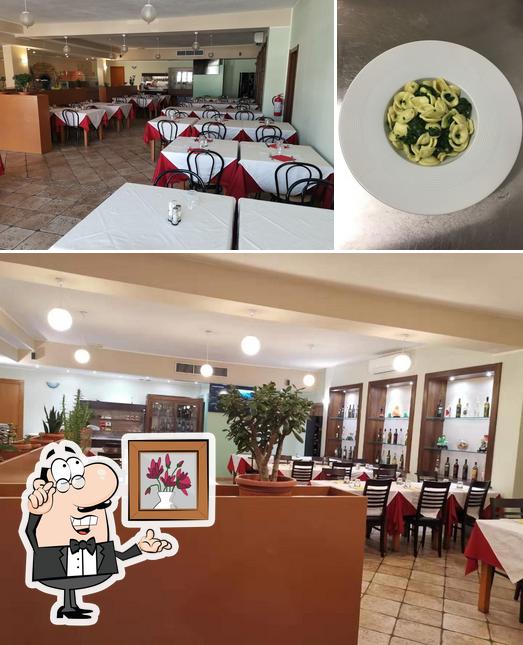 Guarda la immagine che presenta la interni e cibo di Ristorante pizzeria la magnolia