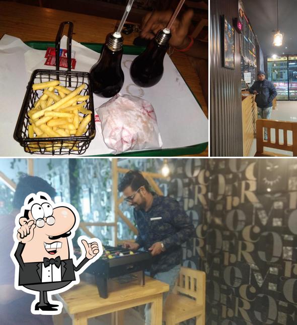 Take a seat at one of the tables at Burger Point Hardoi