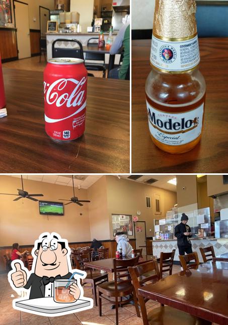 Check out the picture depicting drink and interior at Mary's Restaurant Pollo A La Brasa