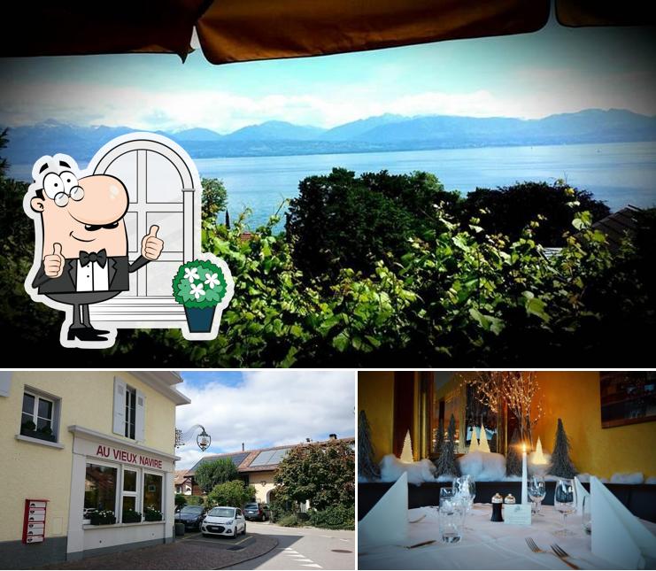 Questa è la foto che mostra la esterno e tavolo da pranzo di Au Vieux Navire