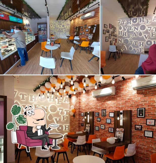 Take a seat at one of the tables at 7th Heaven - Kankavli’s Best cafe