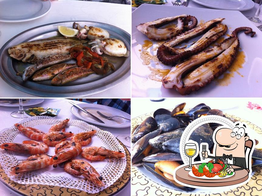 Get seafood at Restaurant Can Mañà