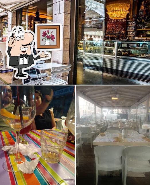 Questa è la foto che mostra la interni e tavolo da pranzo di Frog Lounge Bar
