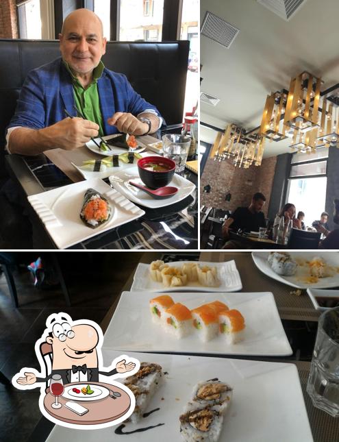 Guarda la immagine che mostra la tavolo da pranzo e sushi di KINN