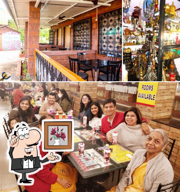 Take a seat at one of the tables at Bagicha Corner