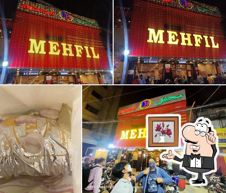 Take a seat at one of the tables at Mehfil