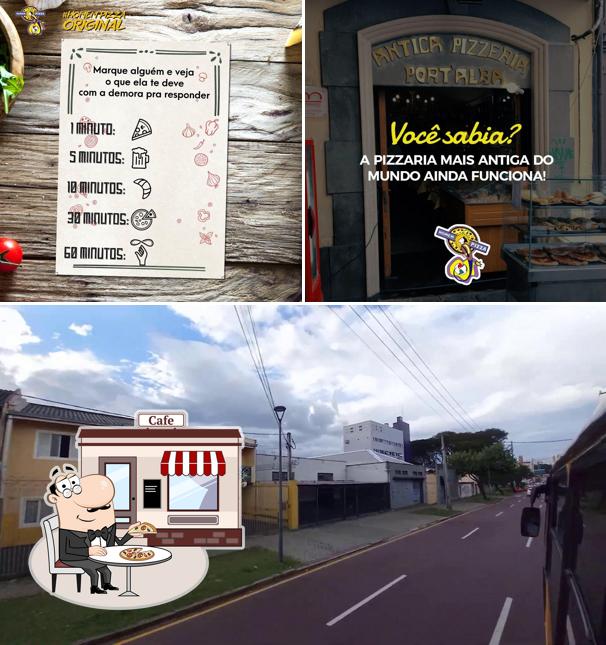 Dê uma olhada a foto ilustrando exterior e comida a Homem Pizza