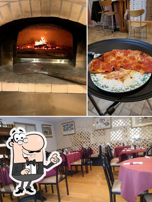 Take a seat at one of the tables at Osteria Peppino Pizzeria