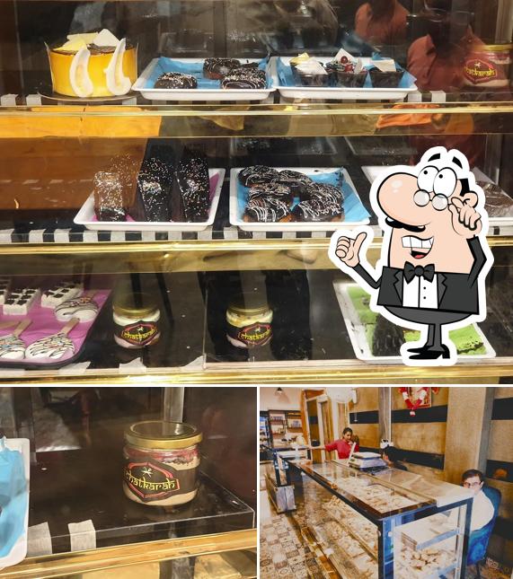 Take a look at the picture displaying interior and food at Chatkarah Bakery & Resturant-Best Bakery Shop/Best Family Resturant/Kitty Party Hall/Pizza Resturant in Amritsar