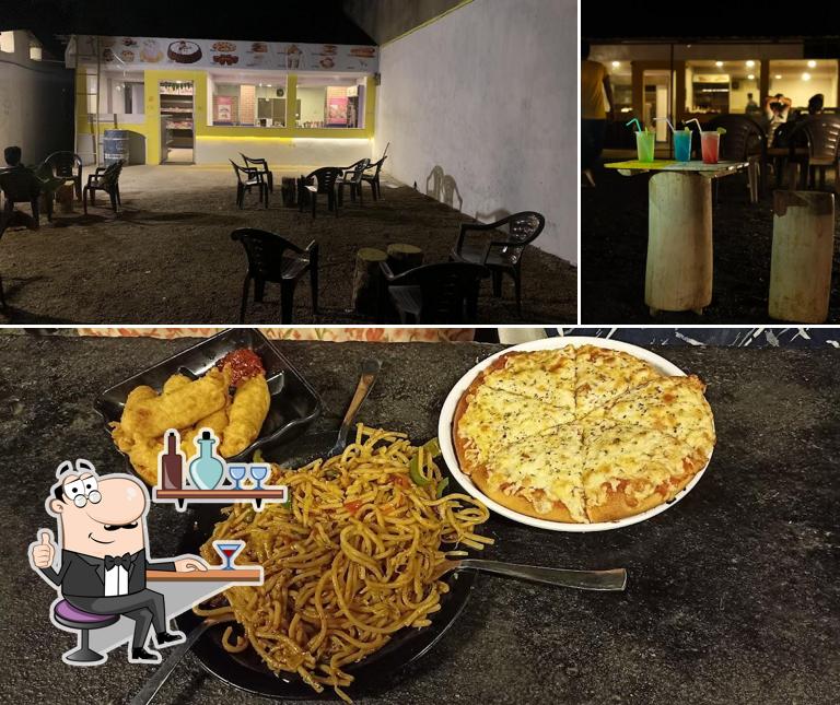 Take a look at the photo showing interior and pizza at Groot Cake n Cafe