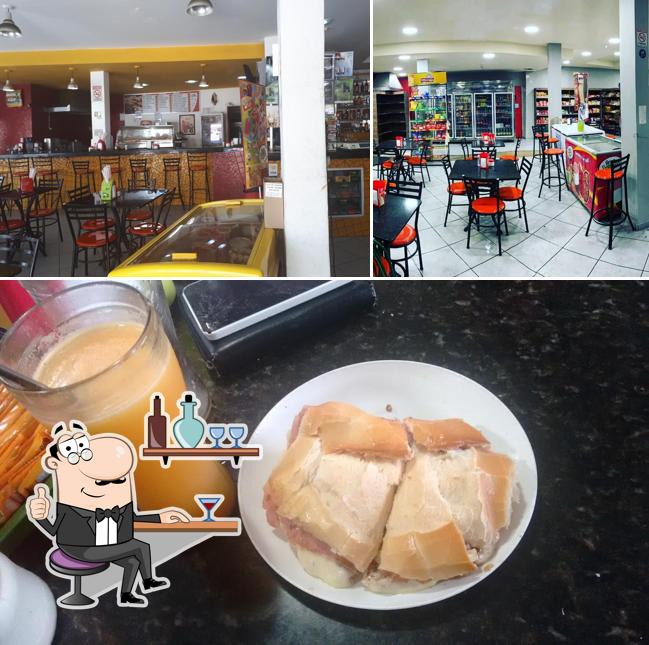 Esta é a imagem apresentando interior e bebida no PADARIA E RESTAURANTE ESTRELA DO PARAISO