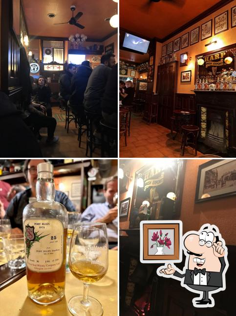 Siediti a un tavolo di Mulligans Irish Pub & Whisky bar