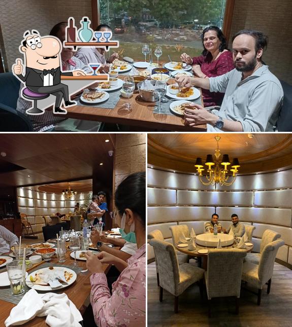 Take a seat at one of the tables at The Yellow Chilli - Noida