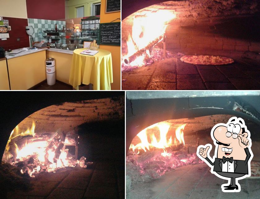 Dai un'occhiata agli interni di L'Altra Pizza