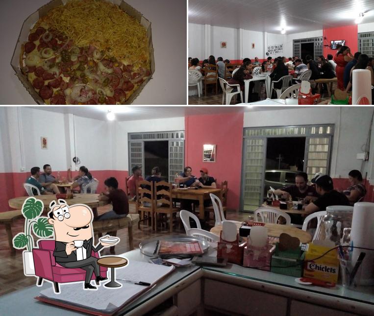 A ilustração da interior e comida a Ls Pizzaria