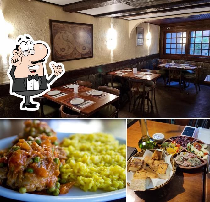 Sente em uma das mesas no Ettore Cucina Italiana