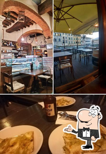 La immagine di interni e tavolo da pranzo da Osteria Pizzeria Al Cantuccio