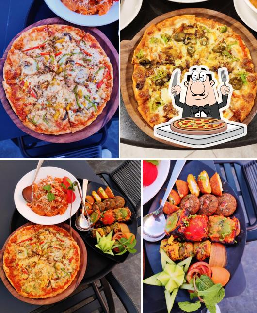 Try out pizza at TMV Rooftop Restaurant Pure Veg
