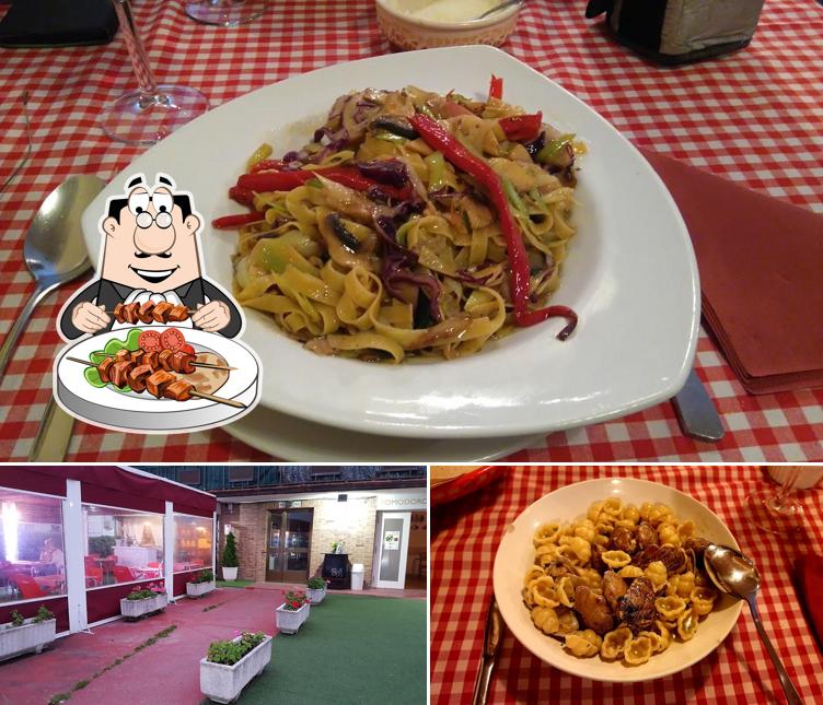 Изображение, на котором видны еда и внешнее оформление в Restaurante Pomodoro