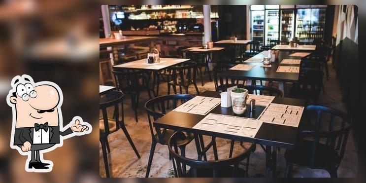 Take a seat at one of the tables at Food Planet
