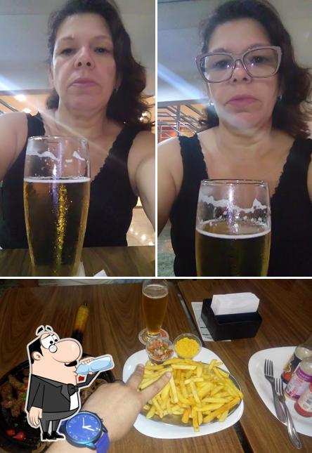 This is the image showing drink and fries at Restaurante Moinhos