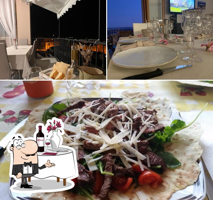 L’image de la table à manger et nourriture concernant Home Restaurant da Trilly