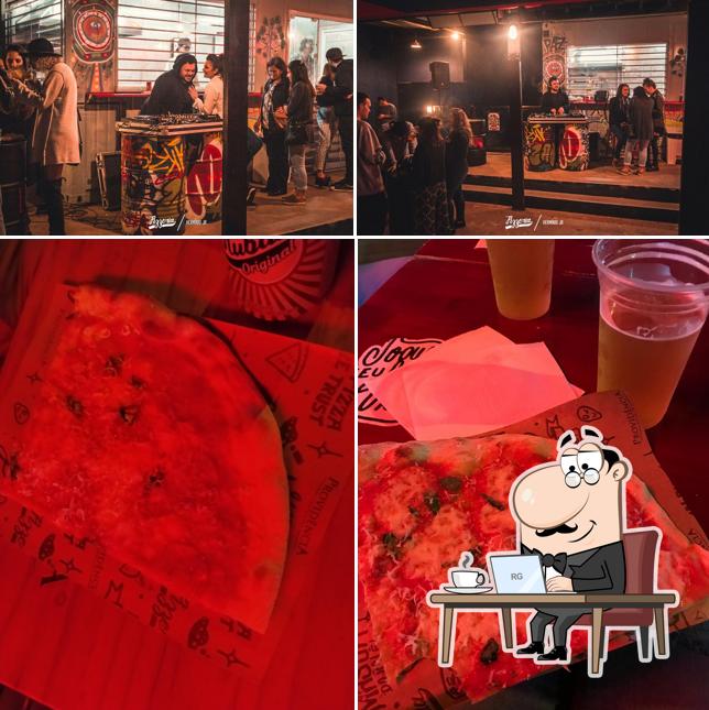 Esta é a foto mostrando interior e comida a Pizzeria