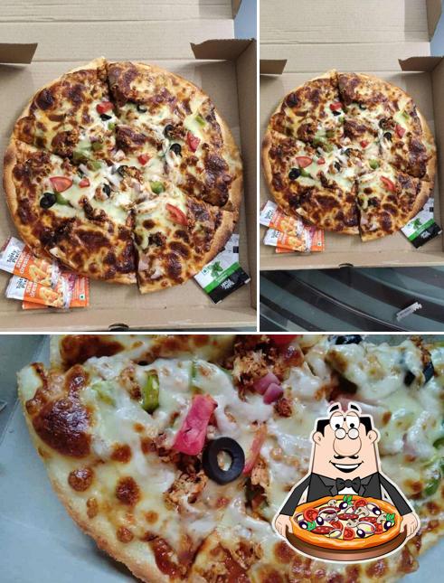 Try out pizza at Veg Palace