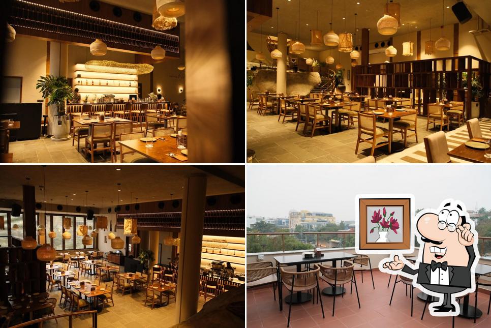 Take a seat at one of the tables at Rü - Craft Bar • Art Cuisine